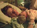 Shauna holds Liam for the first time.